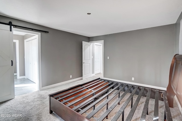 1280 Wonderlick Rd, Lima, OH 45805 - spare room featuring baseboards and a barn door