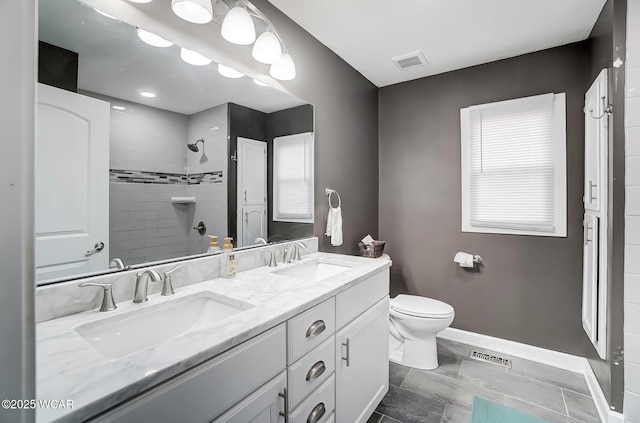 1280 Wonderlick Rd, Lima, OH 45805 - full bath with double vanity, tiled shower, toilet, and baseboards