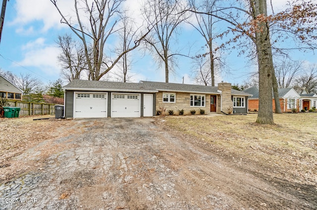 ranch-style home featuring a garage