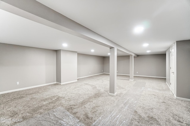 basement featuring light carpet