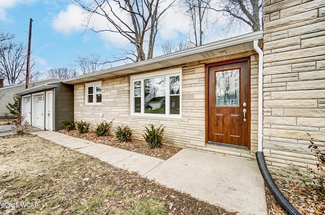 doorway to property featuring a garage