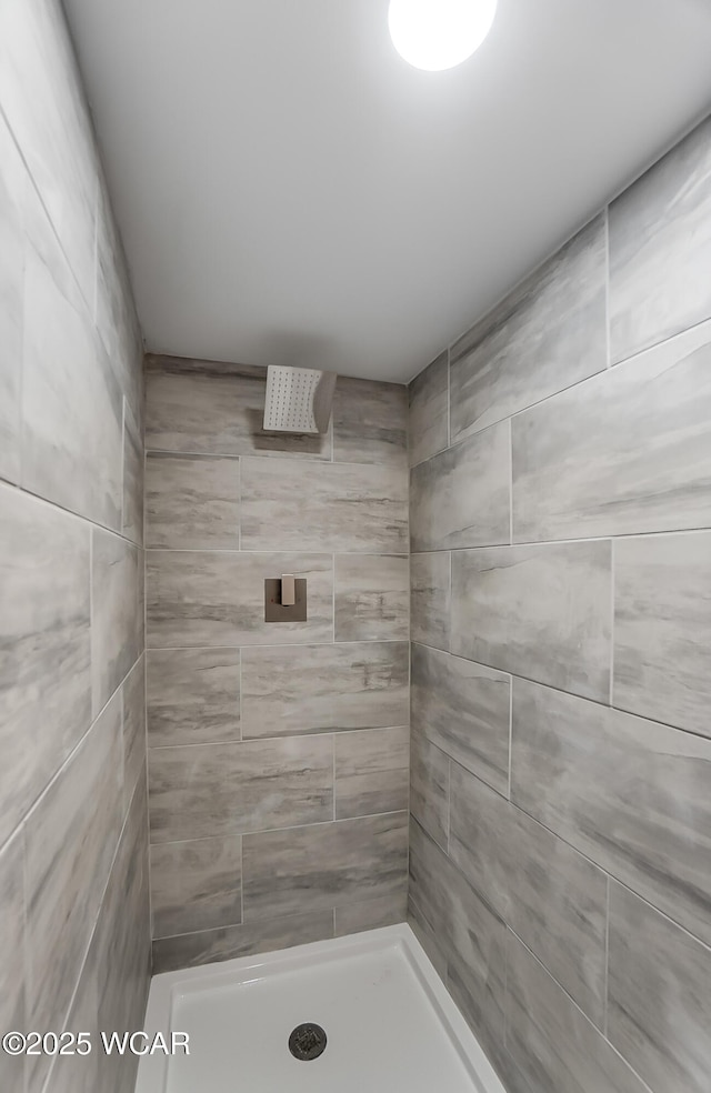 bathroom with tiled shower