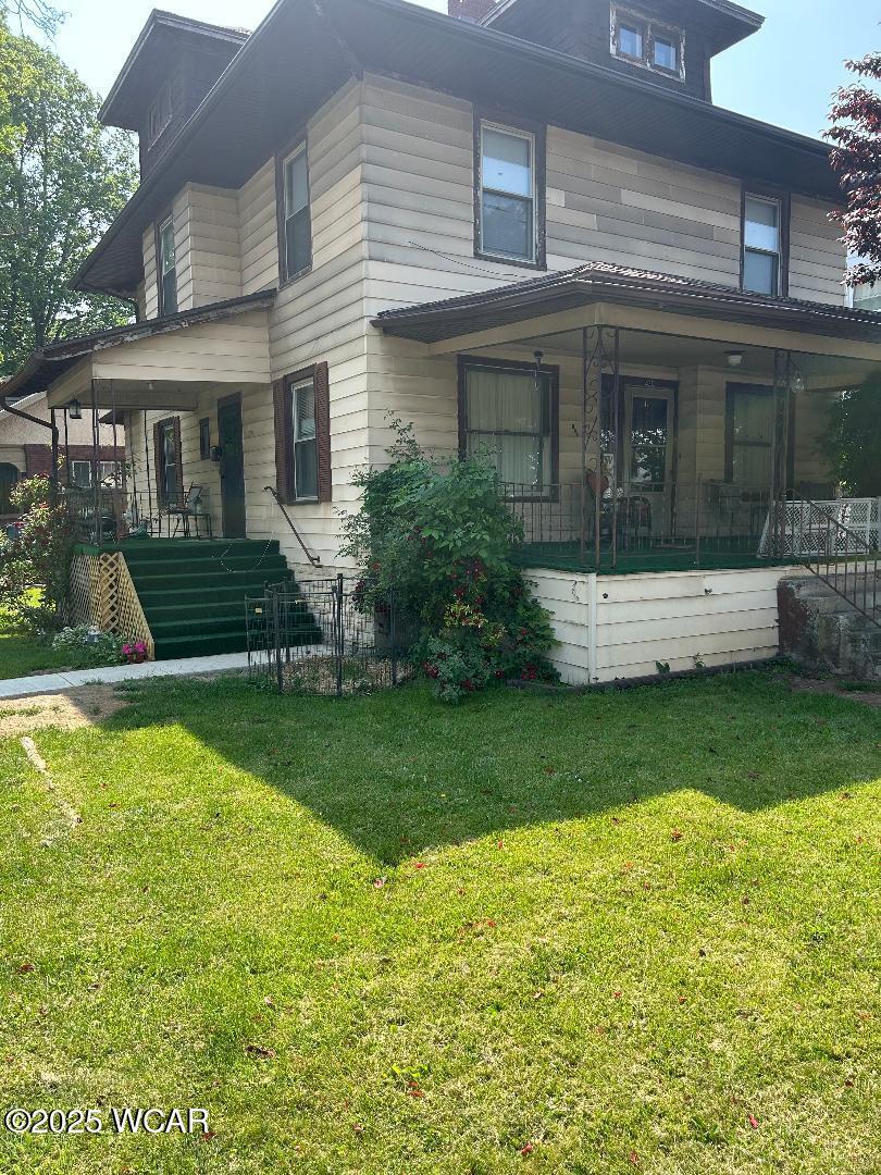 430 N Jameson Ave, Lima, OH 45805 - view of property exterior with a porch, stairs, and a lawn