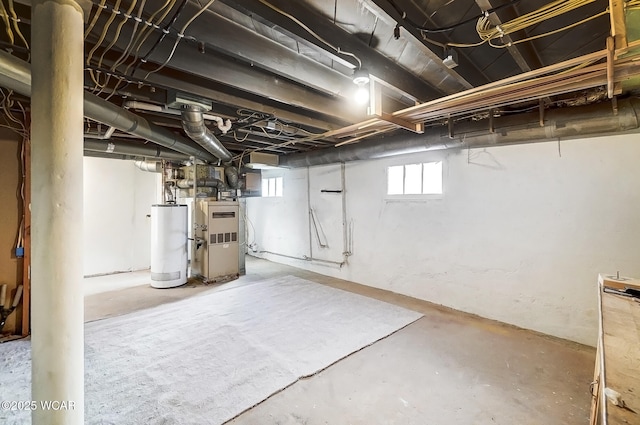 below grade area featuring heating unit and water heater