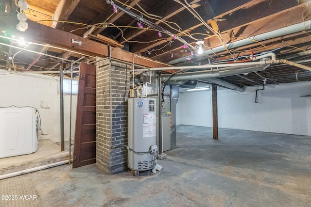 unfinished below grade area featuring heating unit, washer / clothes dryer, and water heater