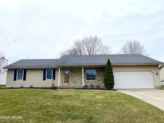 single story home with a garage and a front lawn