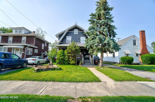 608 W Grand Ave, Lima, OH 45801 - view of front of house with a front lawn and a porch