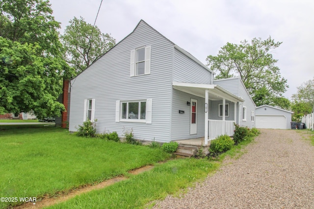 618 N Rosedale Ave, Lima, OH 45805 - view of front facade featuring a porch, an outdoor structure, a front yard, and a detached garage