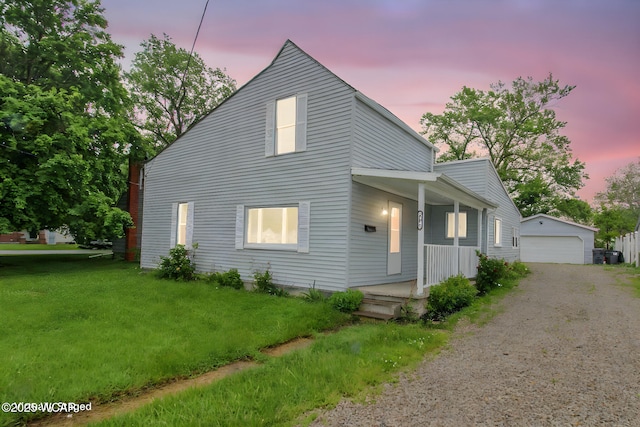 618 N Rosedale Ave, Lima, OH 45805 - view of front of property featuring covered porch, an outdoor structure, a lawn, and a garage