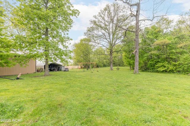 1380 Thomas Rd, New Paris, OH 45347 - view of grassy yard featuring a pole building and an outdoor structure
