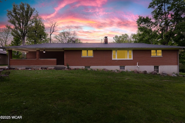 1380 Thomas Rd, New Paris, OH 45347 - single story home featuring brick siding, a front yard, and a chimney