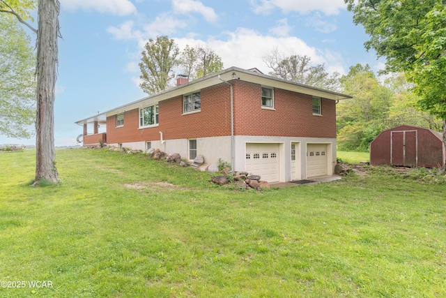 1380 Thomas Rd, New Paris, OH 45347 - view of home's exterior with a garage, a shed, a lawn, brick siding, and a chimney