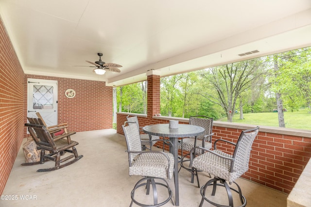 1380 Thomas Rd, New Paris, OH 45347 - view of patio featuring a ceiling fan and outdoor dining area