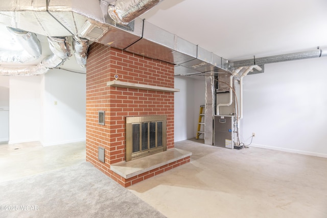 1380 Thomas Rd, New Paris, OH 45347 - finished below grade area featuring a brick fireplace, heating unit, and baseboards
