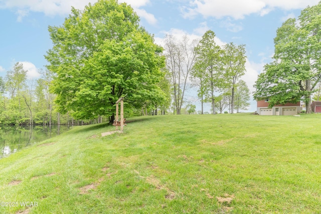 1380 Thomas Rd, New Paris, OH 45347 - view of green lawn with a water view and a garage