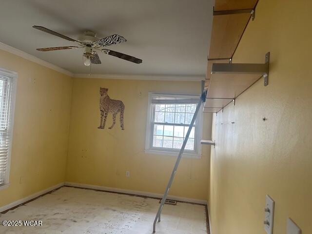 spare room with crown molding and ceiling fan