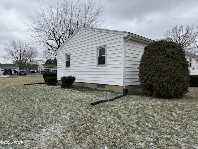 view of home's exterior featuring a lawn