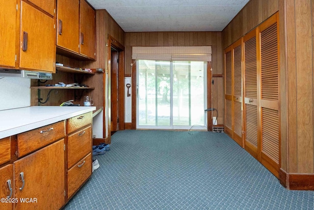 15350 State Route 235, Mount Cory, OH 45868 - kitchen featuring wooden walls, open shelves, light countertops, brown cabinetry, and dark carpet