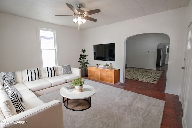 458 W Mckibben St, Lima, OH 45801 - living room featuring arched walkways, ceiling fan, wood finished floors, and baseboards