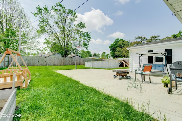 213 Johns Ave, Elida, OH 45807 - view of yard featuring a fire pit and a patio