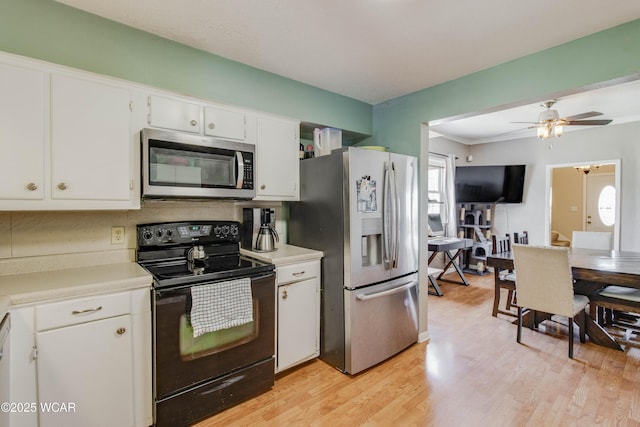 213 Johns Ave, Elida, OH 45807 - kitchen with appliances with stainless steel finishes, light countertops, plenty of natural light, and light wood finished floors
