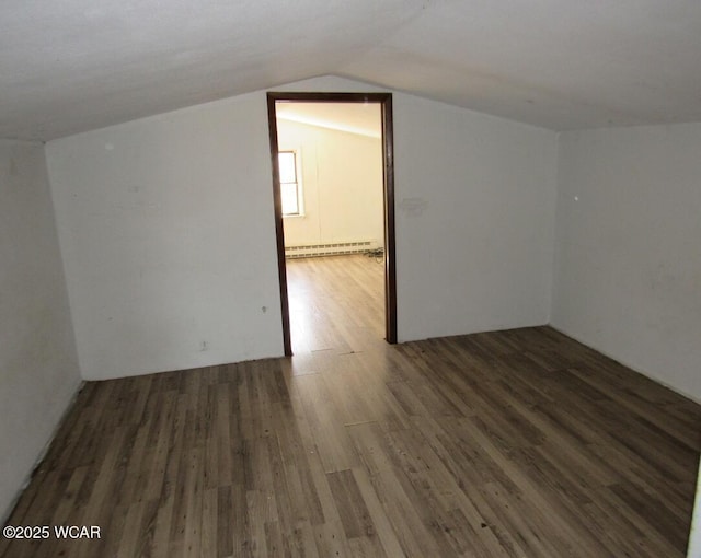 bonus room featuring a baseboard radiator, wood finished floors, and vaulted ceiling