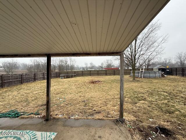 view of yard featuring a fenced in pool