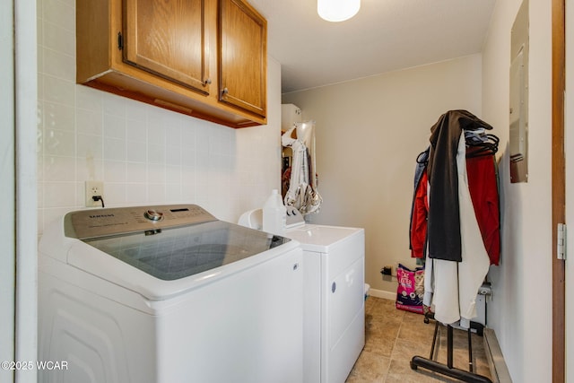 1153 Bahama Dr, Lima, OH 45801 - laundry room featuring baseboards, light tile patterned flooring, cabinet space, and washer and clothes dryer