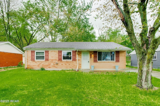1153 Bahama Dr, Lima, OH 45801 - single story home featuring a front lawn, a shingled roof, and brick siding