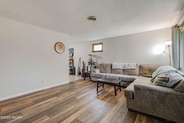 1153 Bahama Dr, Lima, OH 45801 - living area with baseboards, dark wood-style flooring, and visible vents