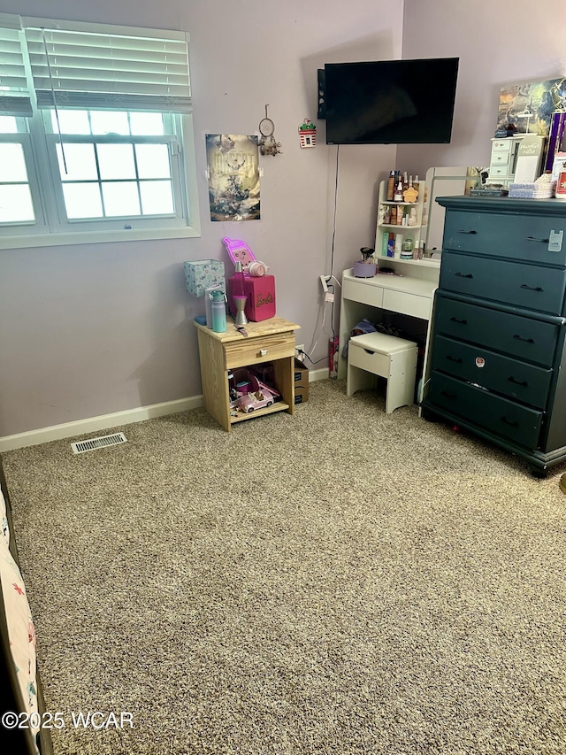 carpeted bedroom with baseboards and visible vents