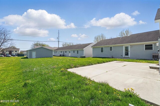 118 S Wagner Ave, Wapakoneta, OH 45895 - rear view of property with a yard and a patio area