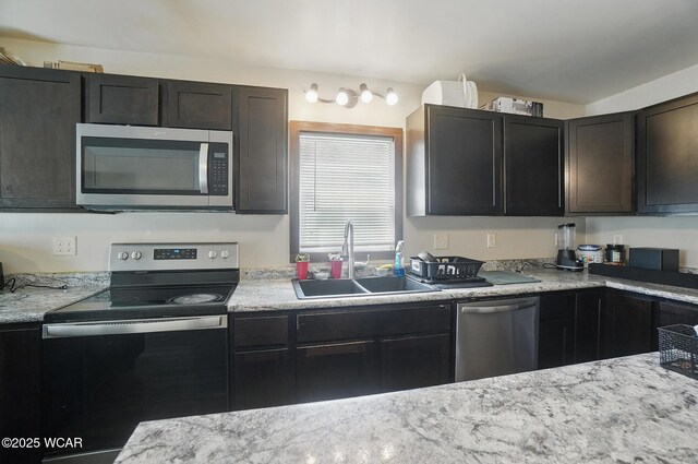 118 S Wagner Ave, Wapakoneta, OH 45895 - kitchen featuring appliances with stainless steel finishes and a sink