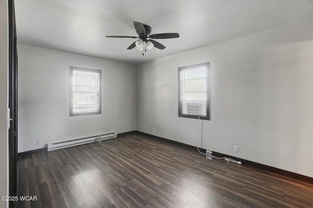118 S Wagner Ave, Wapakoneta, OH 45895 - empty room with dark wood finished floors, a wealth of natural light, baseboard heating, and ceiling fan