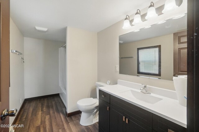 118 S Wagner Ave, Wapakoneta, OH 45895 - bathroom with toilet, baseboards, shower / tub combo with curtain, wood finished floors, and vanity