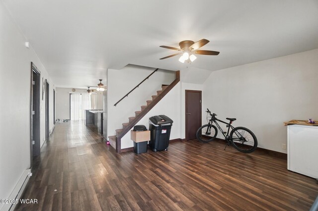 118 S Wagner Ave, Wapakoneta, OH 45895 - interior space featuring baseboards, wood finished floors, a ceiling fan, and stairs