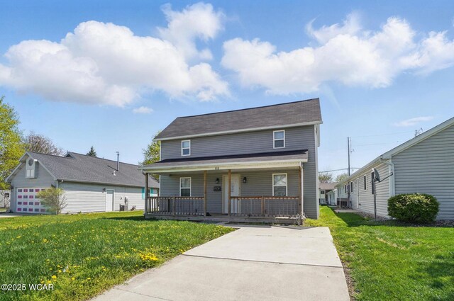 118 S Wagner Ave, Wapakoneta, OH 45895 - view of front of property featuring a porch and a front yard