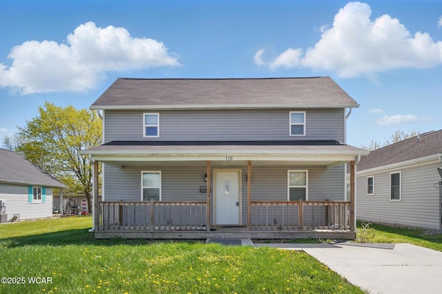 118 S Wagner Ave, Wapakoneta, OH 45895 - view of front of house featuring a porch and a front lawn