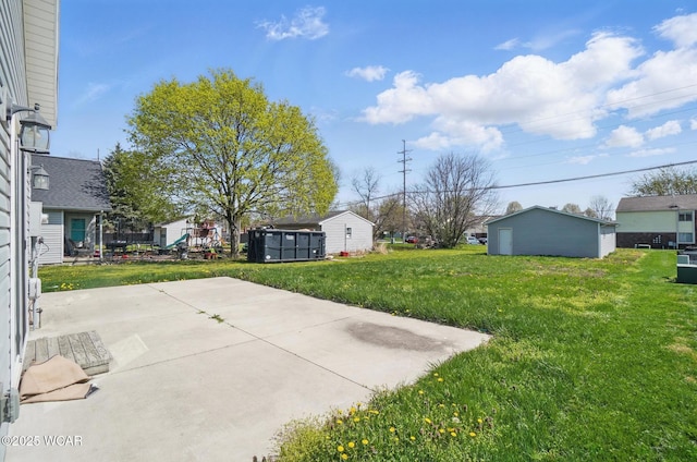 118 S Wagner Ave, Wapakoneta, OH 45895 - view of yard featuring a patio area and an outbuilding