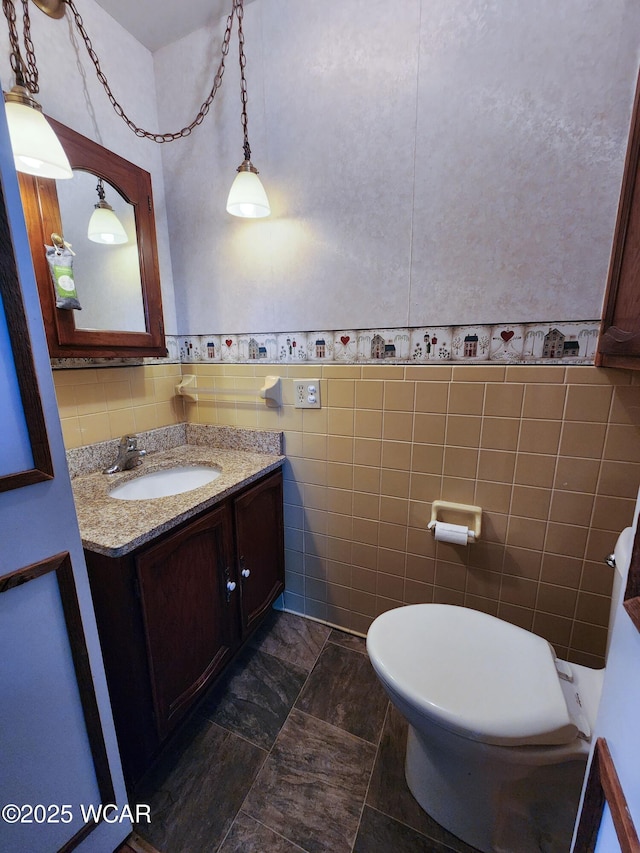 11205 Rd Z, Columbus Grove, OH 45830 - bathroom featuring tile walls, vanity, and wainscoting