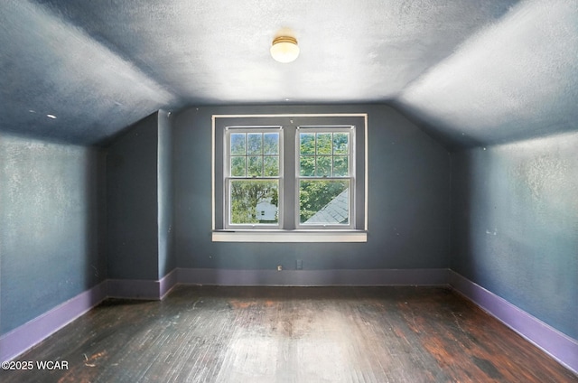 513 Gordon Ave, Van Wert, OH 45891 - additional living space featuring wood-type flooring, vaulted ceiling, and a textured ceiling