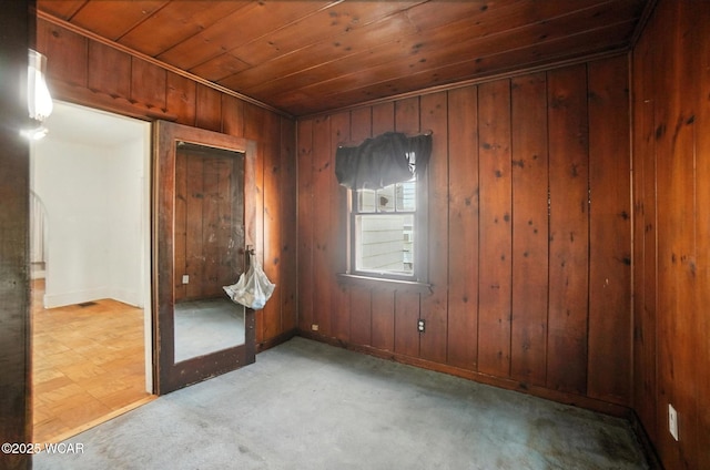513 Gordon Ave, Van Wert, OH 45891 - empty room featuring wooden ceiling, wood walls, and carpet floors