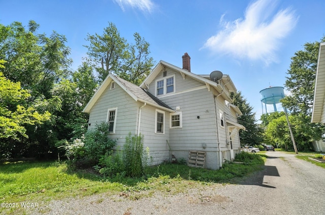 513 Gordon Ave, Van Wert, OH 45891 - view of side of property featuring a chimney and driveway
