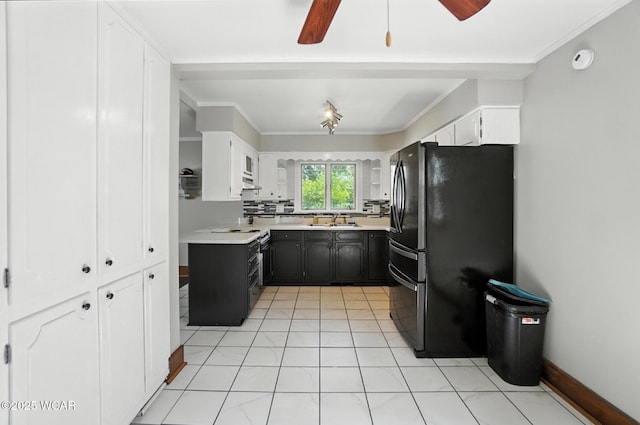 1574 Oakland Pkwy, Lima, OH 45805 - kitchen featuring freestanding refrigerator, light countertops, white cabinetry, ceiling fan, and crown molding