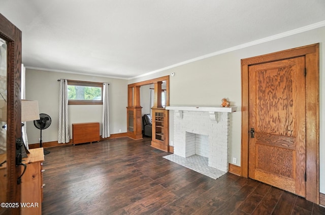 1574 Oakland Pkwy, Lima, OH 45805 - unfurnished living room with wood finished floors, crown molding, and a fireplace