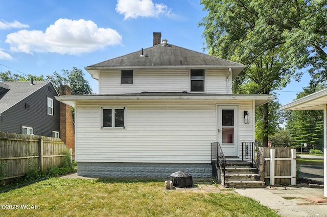 1574 Oakland Pkwy, Lima, OH 45805 - rear view of house featuring a chimney