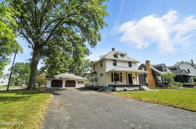 1574 Oakland Pkwy, Lima, OH 45805 - traditional style home featuring a porch, an outdoor structure, a detached garage, a front yard, and a chimney