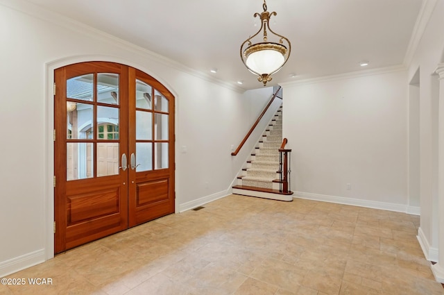 7 Estate Dr, Lima, OH 45805 - entryway featuring french doors, baseboards, ornamental molding, and stairs