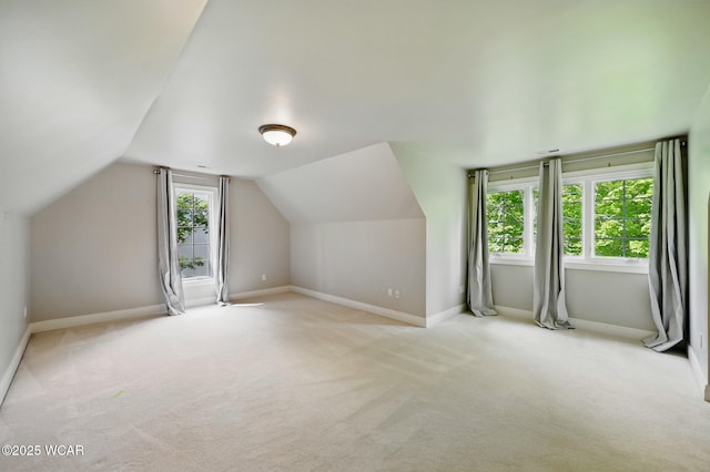 7 Estate Dr, Lima, OH 45805 - bonus room with lofted ceiling, light carpet, and baseboards