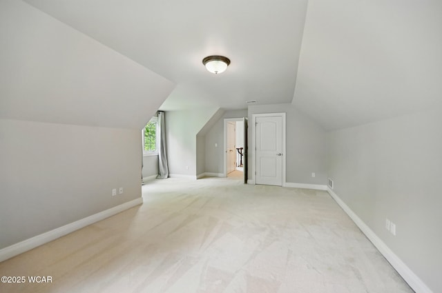 7 Estate Dr, Lima, OH 45805 - additional living space featuring vaulted ceiling, carpet floors, and baseboards